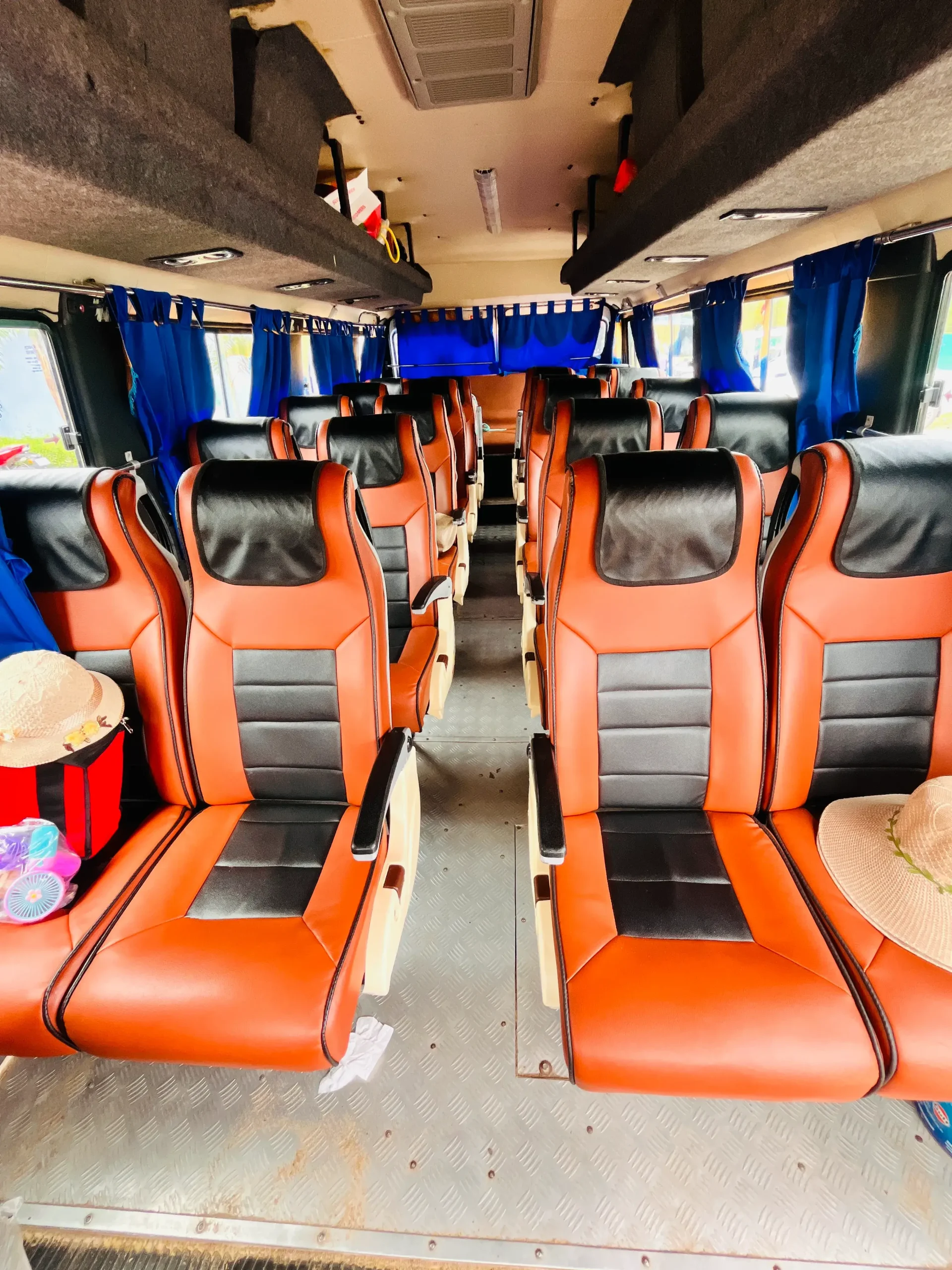 26 seater AC minibus interior for comfortable group travel in Odisha