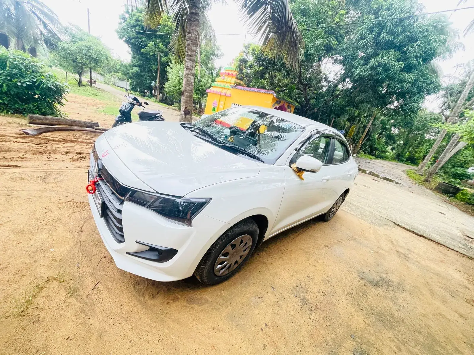 White AC Sedan cab for local Puri sightseeing and airport transfers